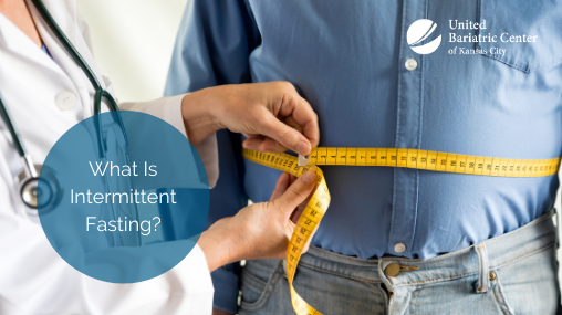 Doctor measuring man's waistline