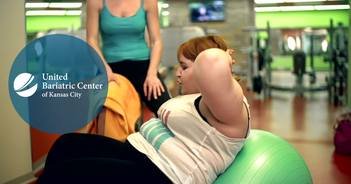 Plus sized woman working out at the gym