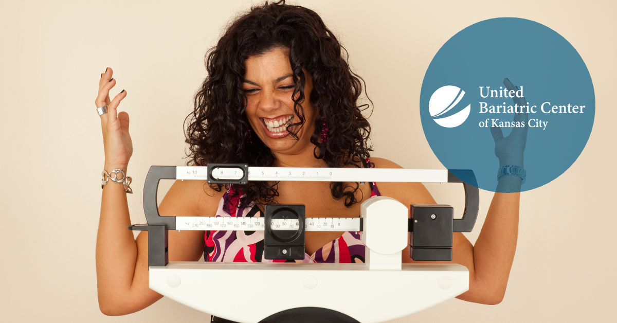 Woman weighing herself on a scale