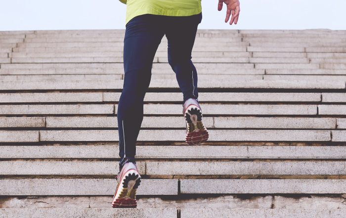 Man running sets of stairs for his winter workout